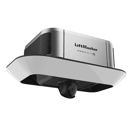 A silver and black LiftMaster garage door opener with a camera, mounted on a white base, viewed from a low angle against a plain light background.